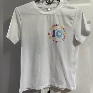 In my double digits era tee shirt.